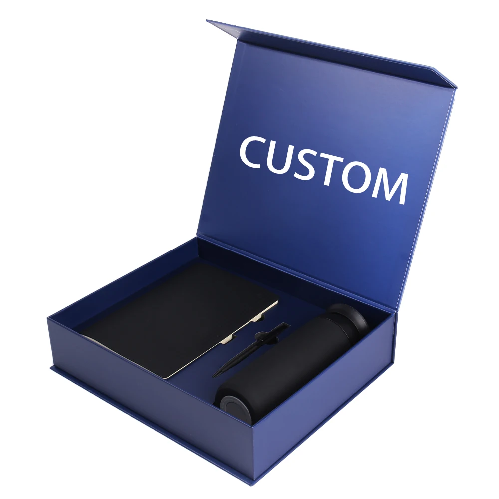 Scatola regalo blu di lusso personalizzata con apertura a ribalta magnetica, in carta rigida con effetto rilievato e rivestimento interno in spugna, per un’elegante confezione regalo aziendale.