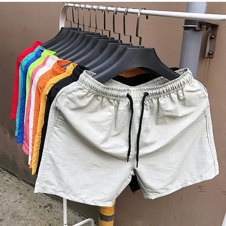 Benutzerdefinierte Unisex-Sommer-Laufsport-Shorts in Übergröße, Sublimations-Polyester-Blank-Shorts für Fitnessstudio, Basketball-Mesh-Herren-Shorts591_voghion.com