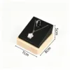 Wooden pendant necklace and ring holder, black leather.