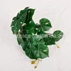 Colgante de pared con hojas de monstera