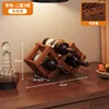 Two-tiered folding wine rack in brown (holds 3 bottles)