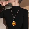 Collar de ámbar fósil con cuentas de madera - Gota de agua
