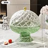 Transparent green spiral patterned drain basket with lid