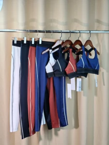 Wholesale Same Brand Front Logo Fashion Yoga Pilates Stretch Seamless Ribbed High-quality Leggings 2 Piece Sets for Women