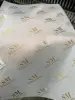 Pink Wrapping Paper With Gold Logo