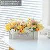 New wooden fence, white roses, 1 orange, 1 yellow.