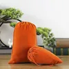 Sac en velours orange à cordon