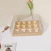 Caja de vasos de papel con 12 cápsulas cuadradas doradas