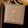 Collana con anelli intrecciati in oro 13 carati