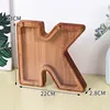 Charcoal-colored boxed K