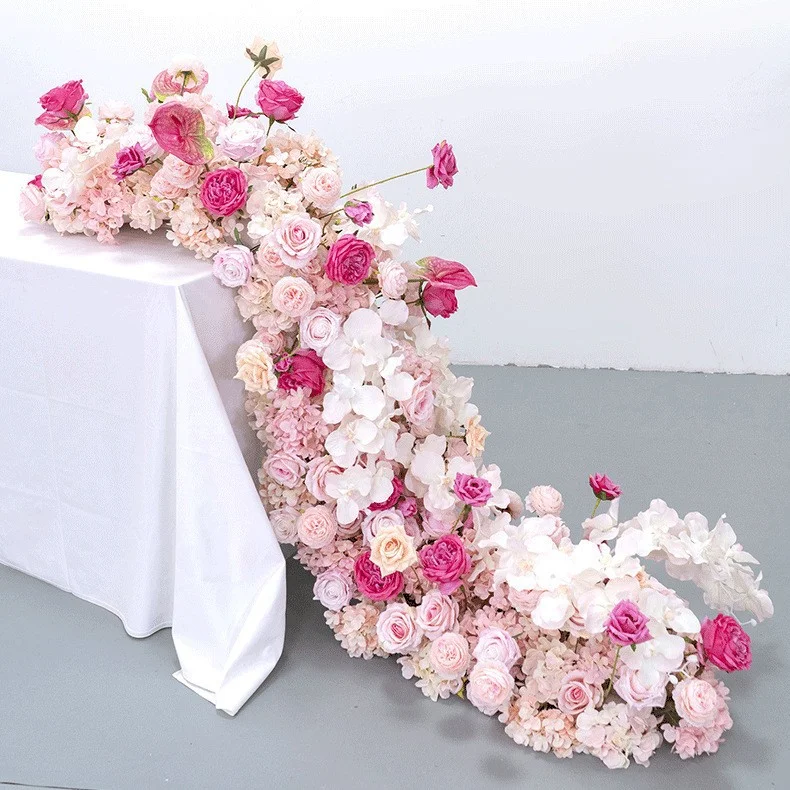 Custom-made artificial flower table runners, floral garlands for wedding decorations, floral arrangements for wedding arches and pathway decorations.