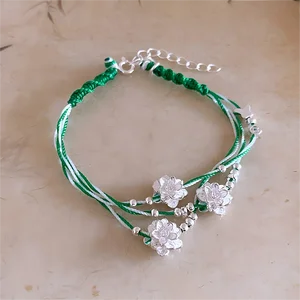 Handmade Braided Bracelet with Silver Flower Charms Green White Thread Woven Bracelet Exquisite Ethnic Style Jewelry for Women