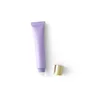 Tubo viola satinato da 20 g + copertura balsamo labbra dorata + tappo interno