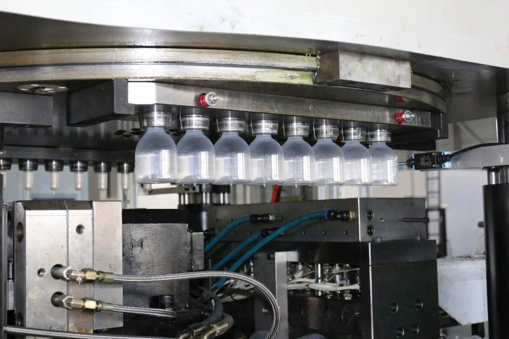 Plastic Injection Molding Machine Apply to Intravenous Fluids and Oral Liquid Bottle Filling Sealing Blowing and Packing Machine