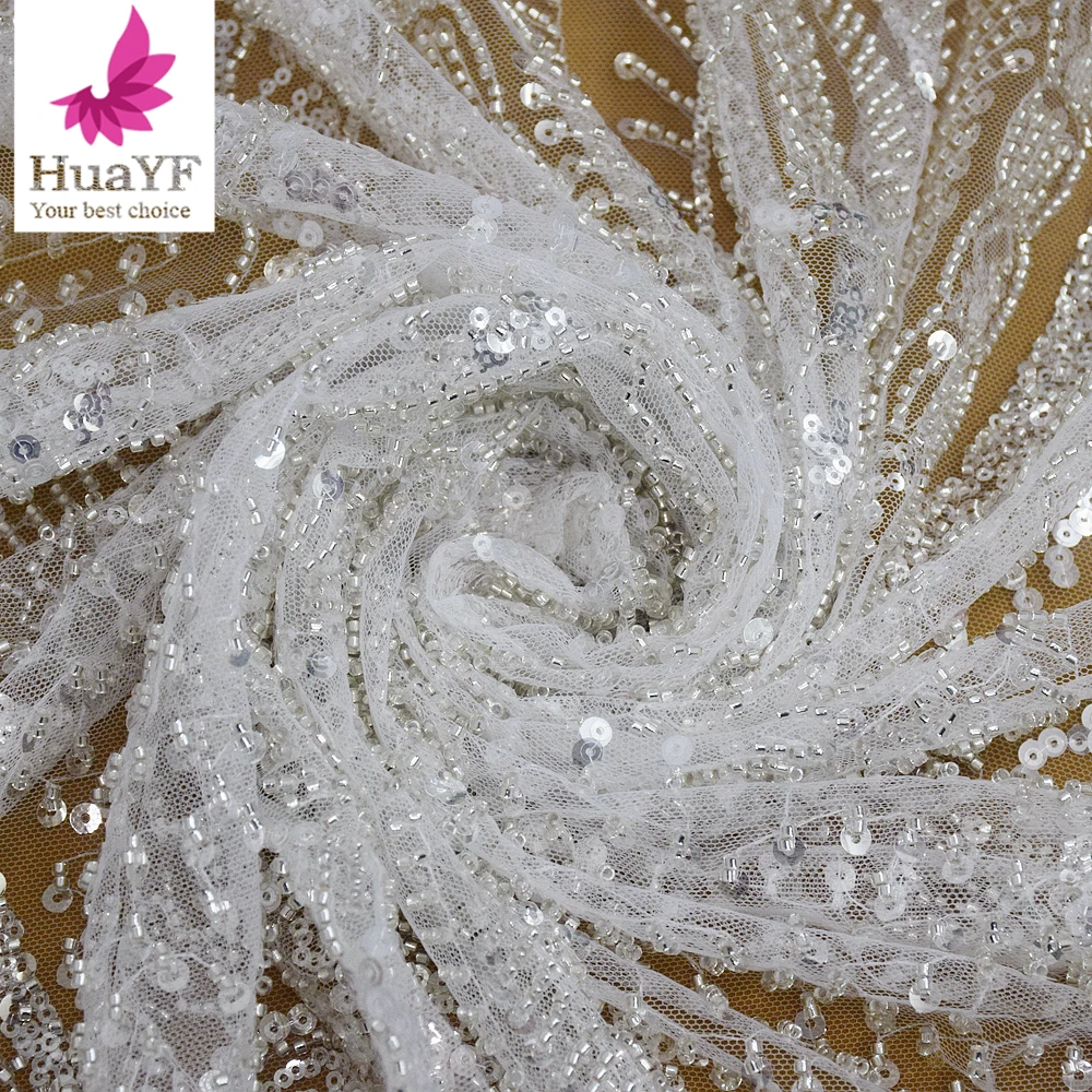 white embroidered dress material White Cotton Floral Embroidered Eyelet Batiste Fabric by the Yard () main image 0