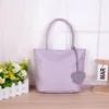 Bolsa individual morada [llevar con ambas manos]