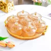 Amber-colored gold-rimmed round plate with 7 serving dishes