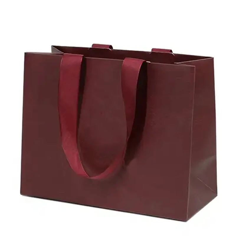 Shop Our Burgundy Red Cardboard Bags with Embedded Handles