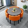 Mesa redonda gris + silla de cuero naranja