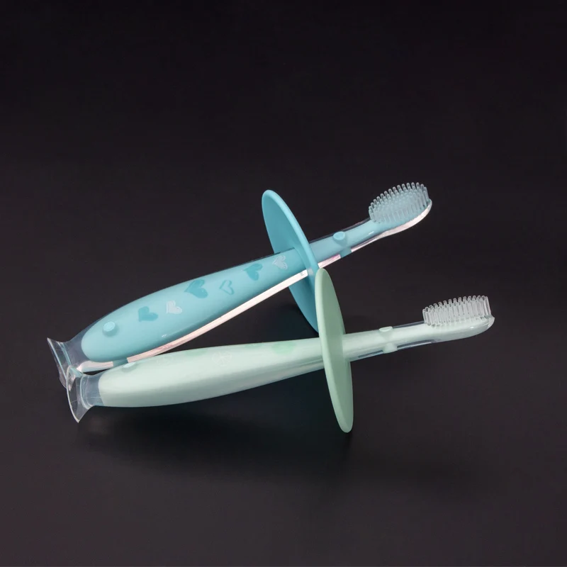 OEM цветной защитный блок, предотвращающий проглатывание, синяя ручка, стоячая всасывающая детская силиконовая зубная щетка