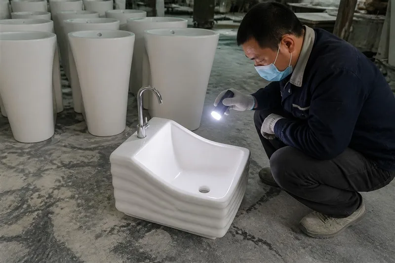 info-1-1 Glazed ceramic foot wash basin coming out of the kiln line
