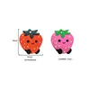 Anneau de dentition en silicone (fraise) (1/2 rouge)