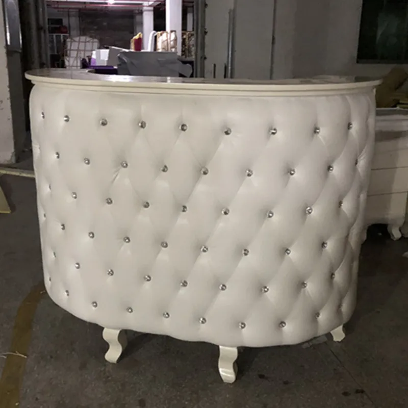 white tufted reception desk