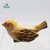 uccello in legno intagliato