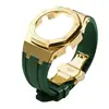 Gold case-green band