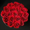 19 rose in scatola rotonda nera