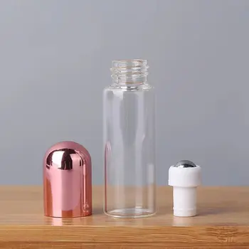 Luxury Roll on Bottles 10ML Empty Round Pink Rose Gold Lid Transparent Glass Pull Tube Bottle With Rolling Steel Balls