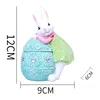 Blue Easter egg sticker face green rabbit