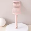 Peine curvo grande rosa