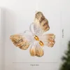 Mariposa tridimensional dorada