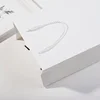 Sac cadeau en papier blanc