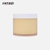 The glossy white cap and frosted jar