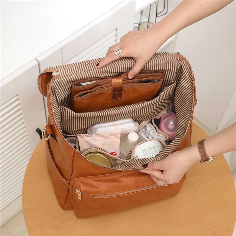 brown pu style diaper bag with changing station for baby diaper backpack