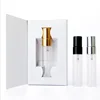 clear perfume bottle with paper box