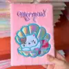 Pink sleeping seashell cat
