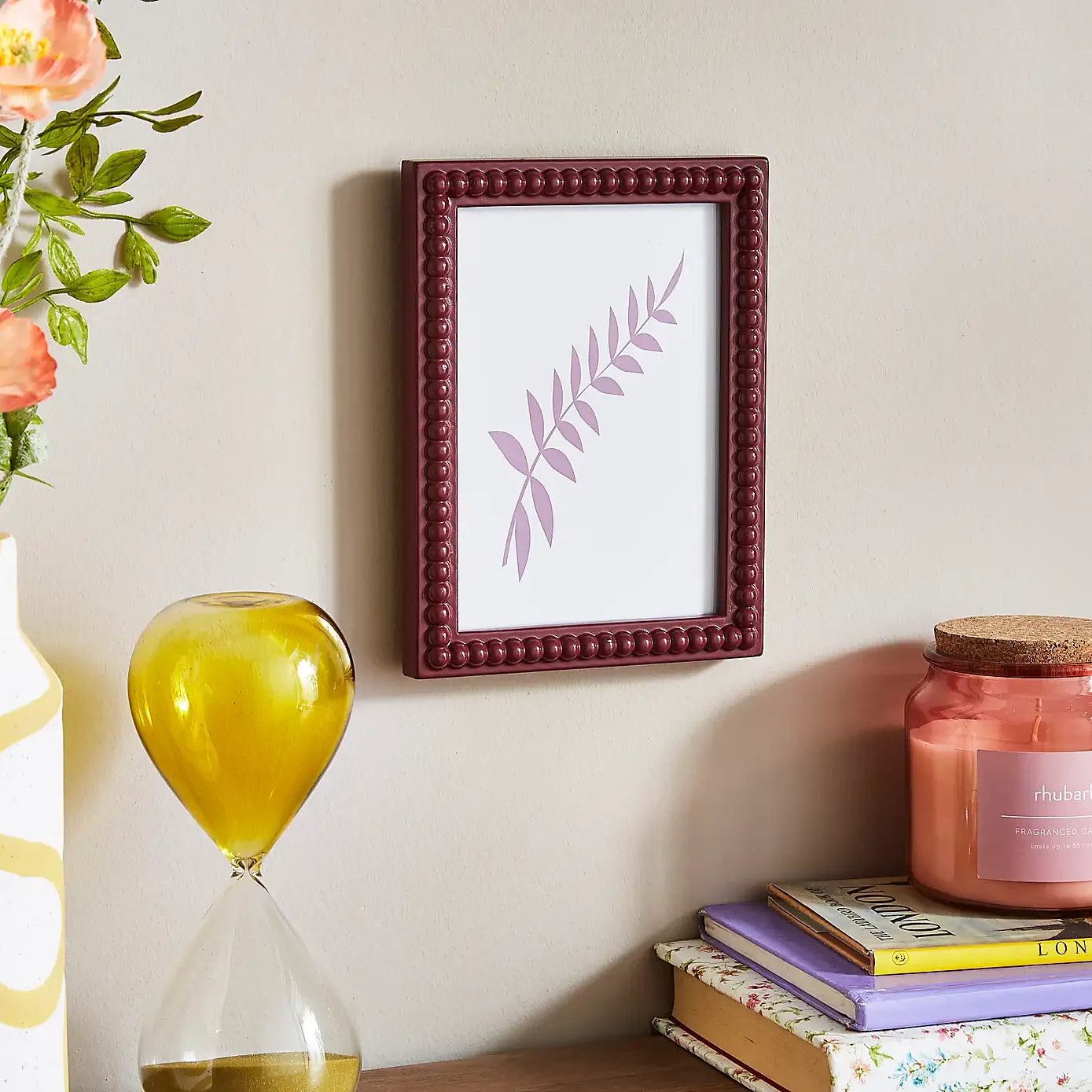 OliviaDecoratesFrameAreasCalculatingDecorableSpaceAroundPhoto