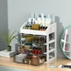 Armoire de rangement à trois tiroirs blanche et noire à quatre niveaux