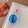 Blue pointed crystal pendant with box chain