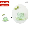 Abito verde con accessori papillon