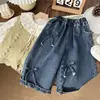 Jeans con fiocco blu