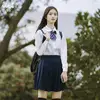 Chemise femme manches longues + jupe élastique bleu marine + noeud papillon