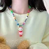 Collar de cuentas de arroz con conejo y zanahoria