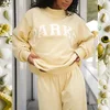 Yellow, white letters with yellow edge