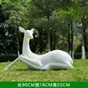 White lying deer