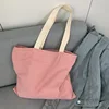 Bandoulière beige à rayures rouges