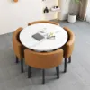 Marble-like round table + brown leather chairs